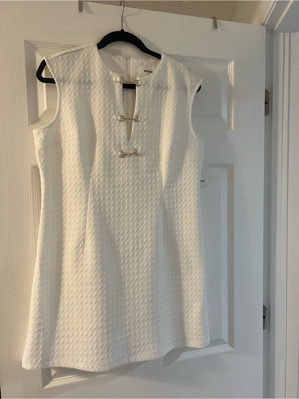 White Sleeveless Mini Dress with Decorative Gold-Accent Closures